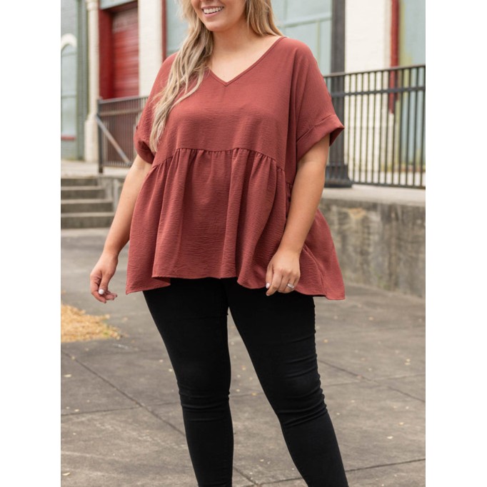 V-neck short sleeved shirt with ruffle hem